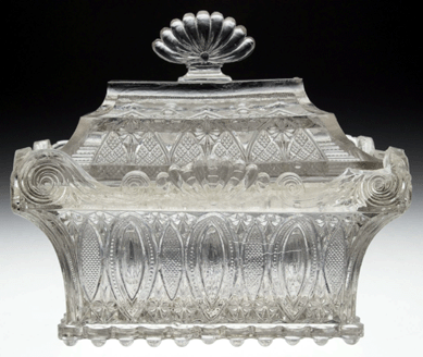 Extremely rare Midwestern lacy covered rectangular casket/dish, colorless, dish with 28 bull's-eye scallops around the base, probably Pittsburgh, 1830‱840, sold for $11,300. This casket is one of only three or four recorded examples. 
