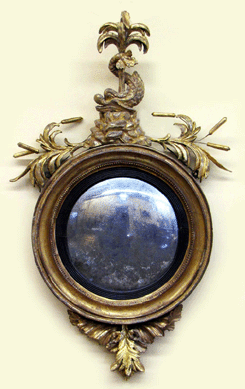 The Federal gilt convex mirror carved with a dolphin amid foliage realized $7,188.