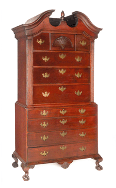 A Chippendale maple two-part chest on chest, attributed to Moses Hazen, Weare, N.H., circa 1800, brought $35,550. It retained the original red stained surface and brass pulls, and measured 83 inches high, 39 inches wide and 20 inches deep.