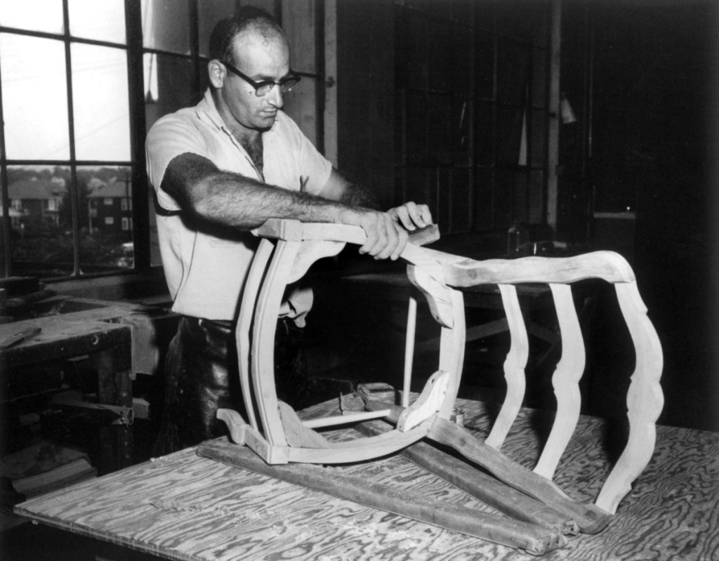 A craftsman in Kaplan’s workshop sands a Chippendale-style ribbon-back chair (also called a ladder-back chair with pierced rails), Cambridge, Mass., 1924. Courtesy, Joseph Downs Collection of Manuscripts and Printed Ephemera, Henry Francis du Pont Winterthur Museum.