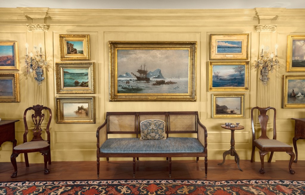 The Lynches displayed maritime paintings and coastal views in the East Room of their Marblehead Neck house. A treasure of the collection is “Among the Ice Floes,” center, by William Bradford. The oil on canvas of 1878 hangs above a circa 1810 caned settee, possibly from the shop of Duncan Phyfe. It is flanked by groupings of Eighteenth Century furniture from Philadelphia and Boston. © Peabody Essex Museum. Photography by Kathy Tarantola.