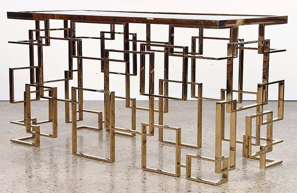 Both sales were led in value by this brass geometric console table with smoked glass that sold for $13,000. It came from a New York consignor and the auction house said it was from the 1970s.