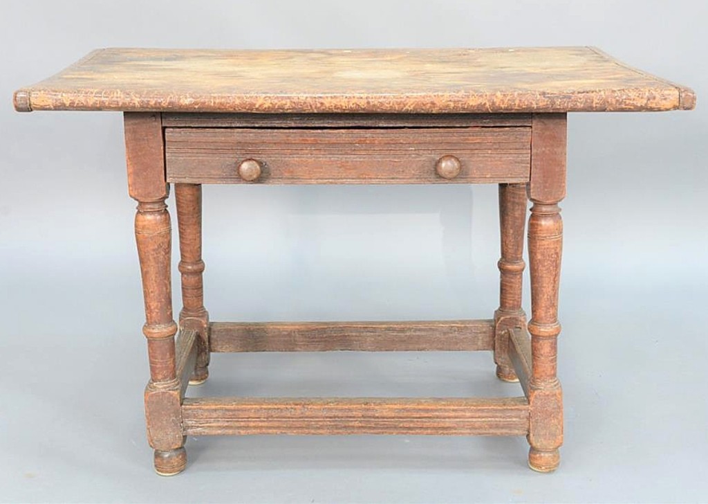 With molded drawer face and stretchers, this New England tavern table was dated to the late Seventeenth Century by the auction house. With some old brown paint, the table took $20,740 on a $4,000 estimate. Diana Atwood Johnson Collection.